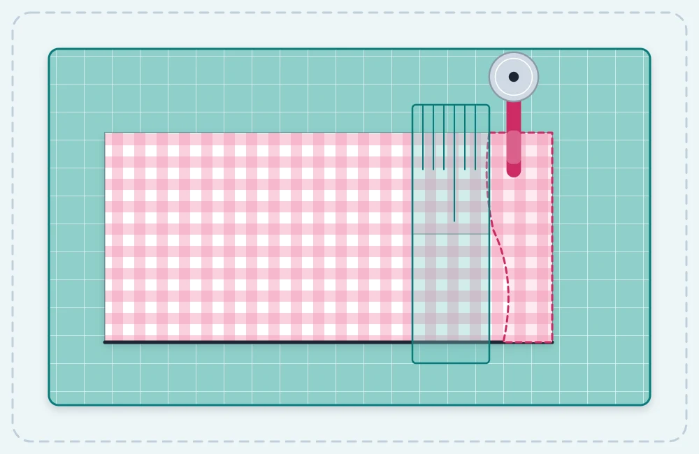 Folded fabric on a cutting mat with a ruler squared against the fold and an uneven edge being trimmed away