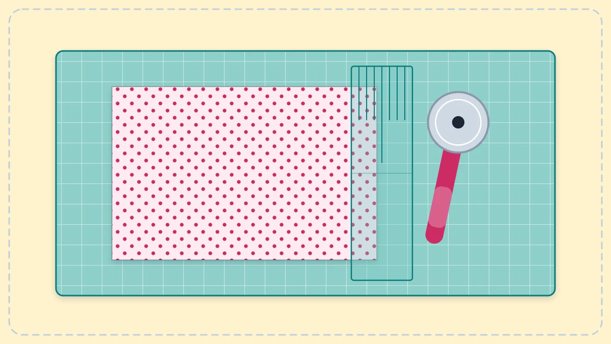 Cutting mat with a rotary cutter, a clear ruler and a piece of fabric