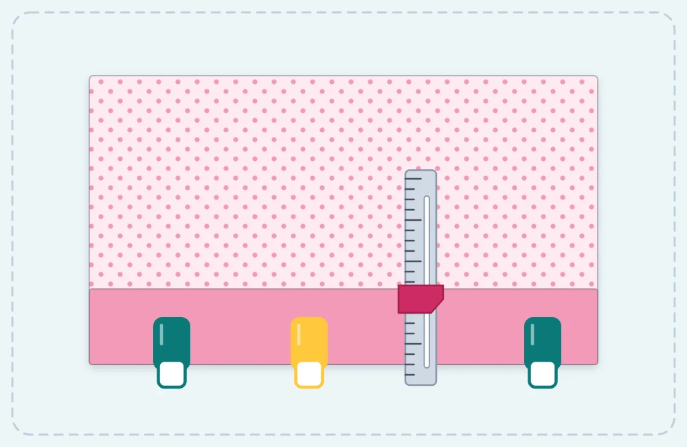 Seam gauge measuring the depth of a folded hem that is held in place with sewing clips