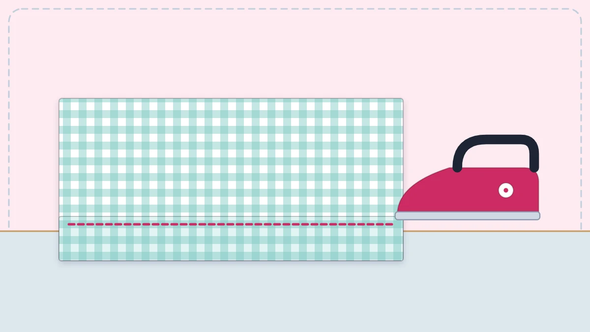 Hemmed fabric edge, folded and stitched, with an iron nearby