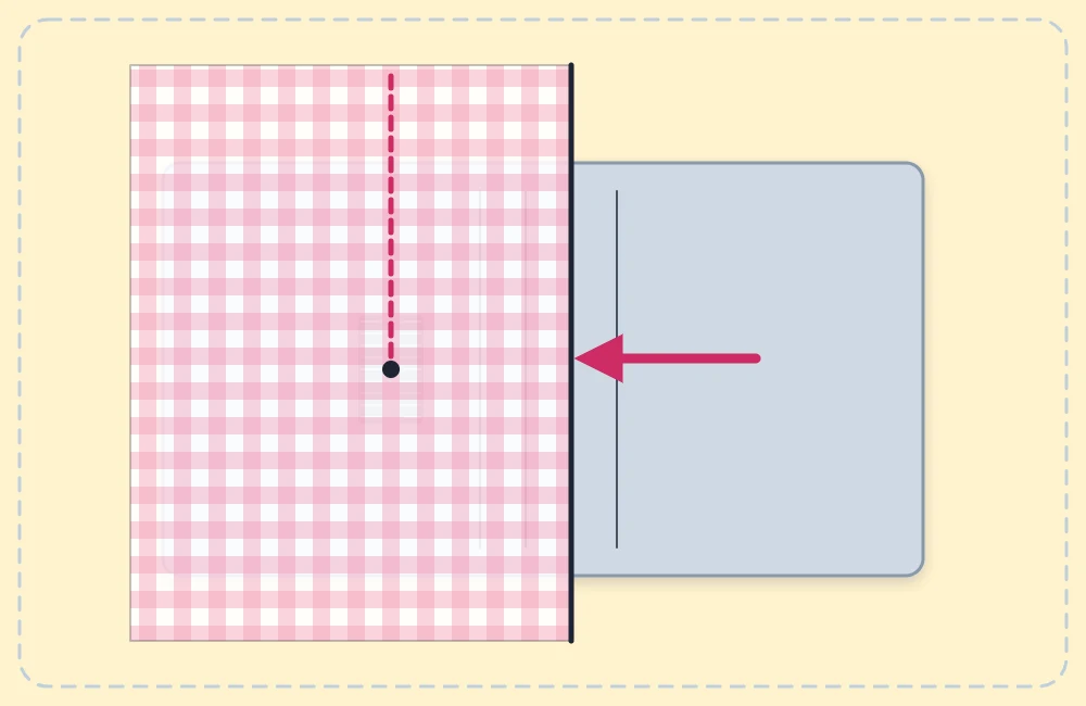 Needle plate with seam guide lines and a fabric edge running along one line, with an arrow pointing at the fabric edge