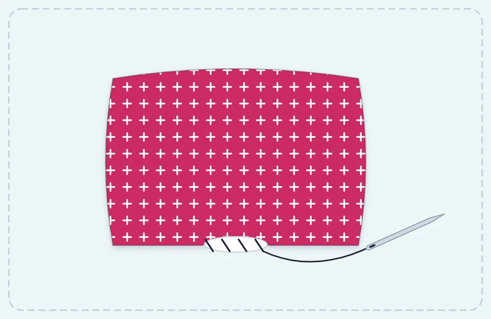 A stuffed square pincushion with a hand needle and thread closing the open gap with a ladder stitch